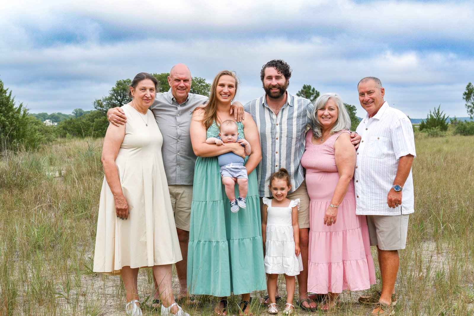 Family in complementary colors on the beach in Virginia Beach