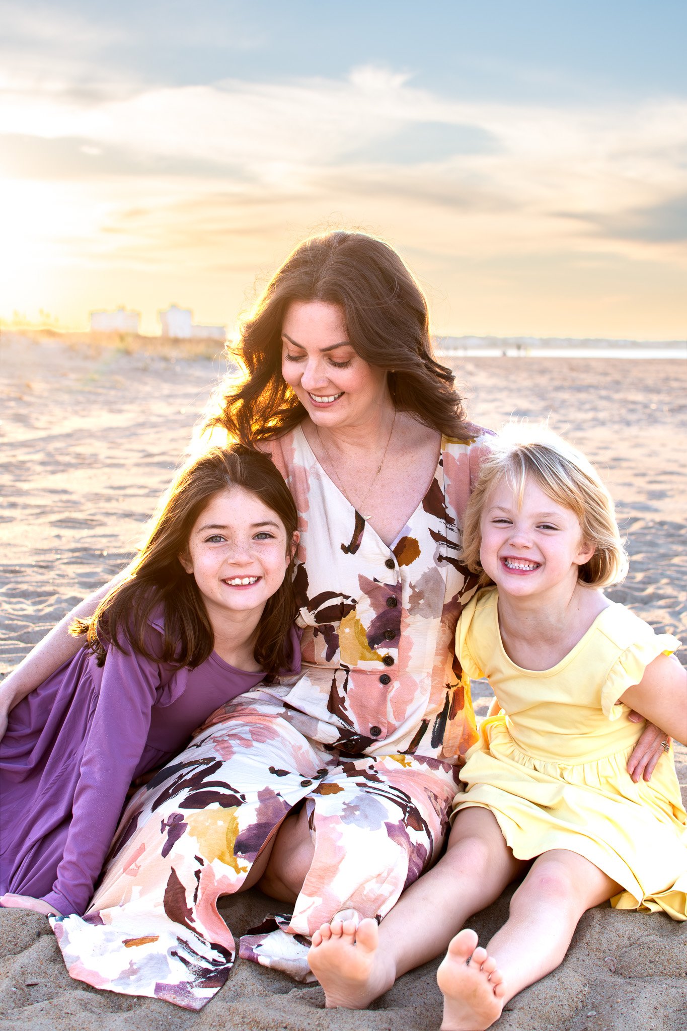 Mom and her kids snuggling during a Mom and Me session in Virginia Beach